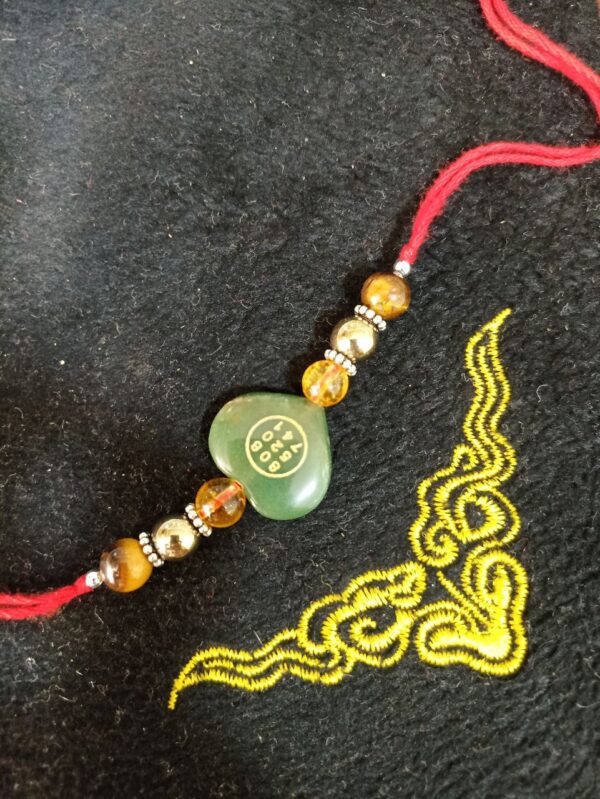 Green Jade Stone Money Switch Word Zibu Heart Symbol Rakhi | Citrine, Tiger Eye and Golden Hametite Agate Rakhi - Image 2